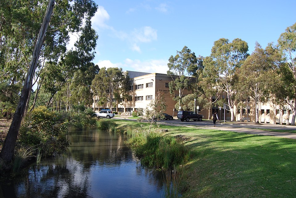 Moat with the George Singer Building in the background at La Trobe University, Bundoora, Australia